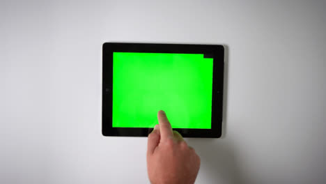 Flat-Lay-Tablet-Green-Screen-Finger-Moving-Top-Right-
