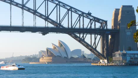 Boat-Passing-Sydney-Bridge-and-Opera-House