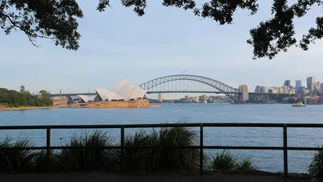 Sydney-Bridge-and-Opera-House-with-trees-and-fence