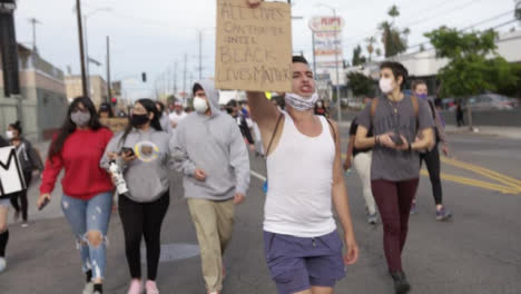 Hollywood-Male-Chanting-and-Carrying-Anti-Racism-Sign-During-Protest