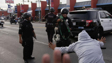 Hollywood-Police-With-Gun-Shouting-at-Protesters