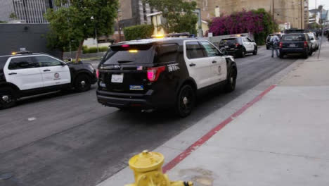 Hollywood-Police-Vehicles-Slowly-Moving-on-Street