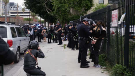 Hollywood-Protesters-Arrested-and-Zip-Tied-against-Fence