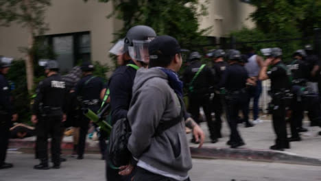 Hollywood-Arrested-Protester-Talking-to-Police-Officer