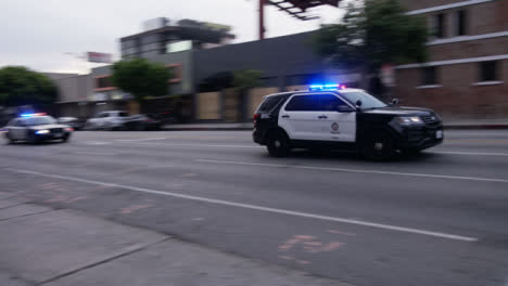 Hollywood-Pan-Convoy-of-US-Police-Cars-Driving-Past