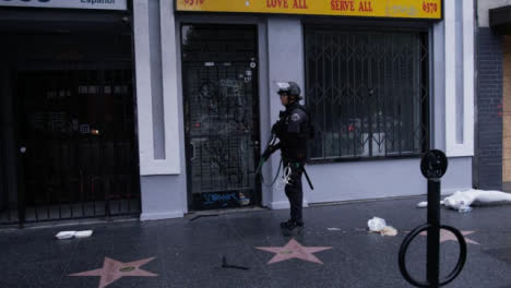 Hollywood-Armed-Police-Officer-Ordering-People-To-Move