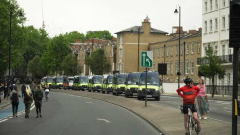 London-Line-of-Police-Vans-on-Street