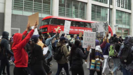 London-Anti-Racism-Protesters-Marching-past-Bus
