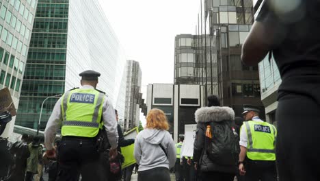 London-Police-Officers-Walking-With-Protesters