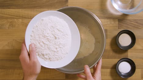 Top-View-Pouring-Flour-in-Bowl