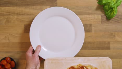 Top-View-Cooked-Pizza-on-Peel-Placed-on-Plate