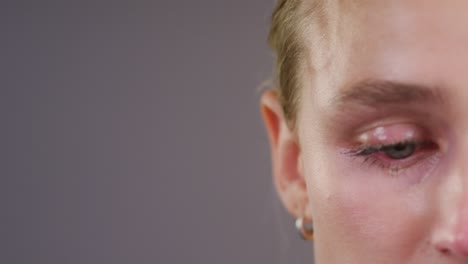 Close-Up-of-Woman-with-Tear-Rolling-Down-Cheek