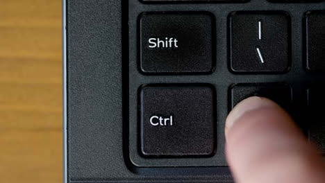 Finger-Pressing-Ctrl-Keyboard-Button-Top-View