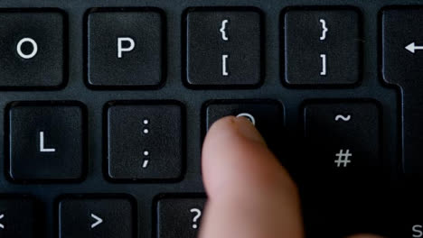Top-View-Finger-Pushing-Apostrophe-Button-Keyboard