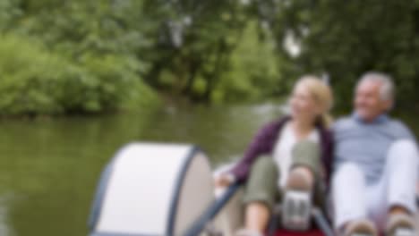 Blurred-Couple-in-Pedal-Boat-on-River