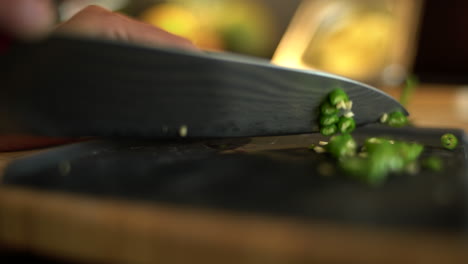 Extreme-Close-Up-of-Female-Hands-Dicing-a-Green-Bean