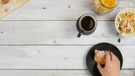 Top-View-Eating-Croissant-and-Drinking-Coffee-with-Copy-Space