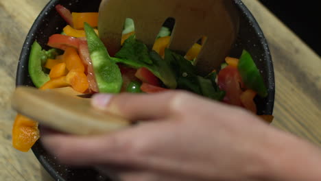 Close-Up-of-Female-Hands-Mixing-Salad-Bowl-Contents