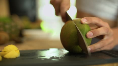 Close-Up-of-Female-Hands-Cutting-a-Mango-