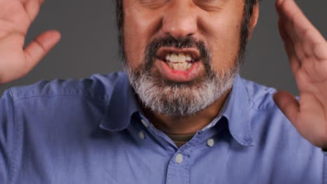 Middle-Aged-Man-Visibly-Annoyed-and-Shouting-Portrait