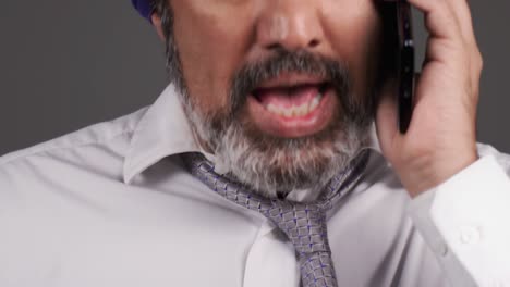 Middle-Aged-Businessman-In-Turban-Having-a-Heated-Phone-Call