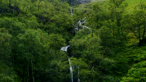 Aerial-Drone-Shot-of-Downhill-Stream-and-Waterfall-in-Glen-Coe