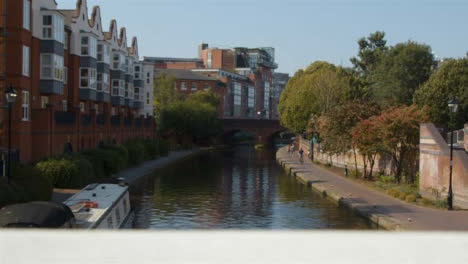 Panning-Shot-of-Cyclist-Alongside-Canal-In-Birmingham-