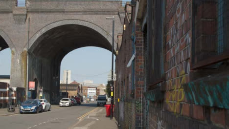 Tracking-Shot-of-Road-Running-Underneath-Bridge-In-Birmingham