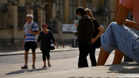 Wide-Shot-of-People-Socialising-On-Street-as-Traffic-Goes-By-In-Oxford-02