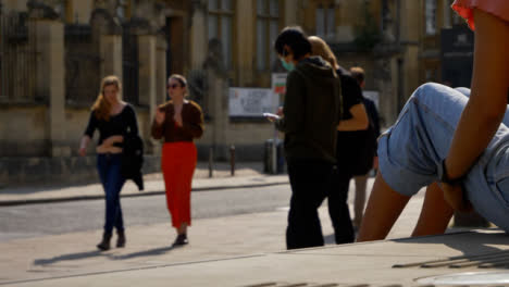 Wide-Shot-of-People-Socialising-On-Street-as-Traffic-Goes-By-In-Oxford-03