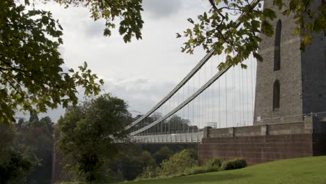 Sliding-Shot-From-Behind-Tree-Revealing-Clifton-Suspension-Bridge-In-Bristol-