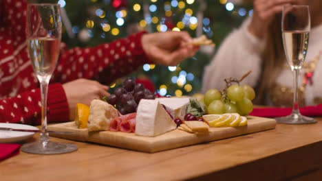 Close-Up-Shot-of-Couples-Table-Food-Spread-During-Christmas-Celebrations-