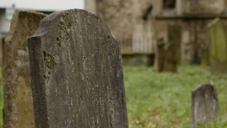 Panning-Shot-of-Tombstone-In-Graveyard-In-Oxford-England