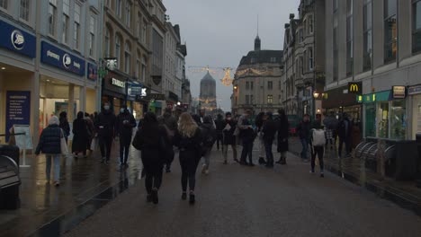Tracking-Shot-of-People-Walking-Down-Busy-Shopping-Street-In-Oxford-England