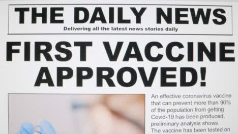 Dolly-Out-Extreme-Close-Up-Shot-of-Coronavirus-Vaccine-News-Article-On-Computer-Screen