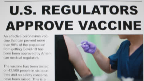 Close-Up-Shot-of-Scrolling-Covid-19-Vaccine-Approval-News-Article-On-a-Computer-Screen
