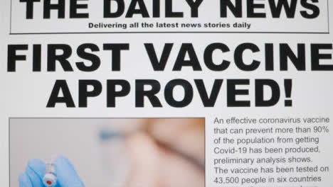 Dolly-Out-Close-Up-Shot-of-First-Covid-19-Vaccine-Approval-News-Article-On-a-Computer-Screen