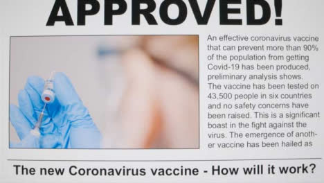 Close-Up-Shot-of-First-Covid-19-Vaccine-Approval-Scrolling-News-Article-On-a-Computer-Screen