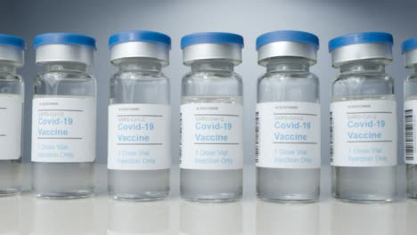 Sliding-Close-Up-Shot-of-Vials-of-Covid-19-Vaccine