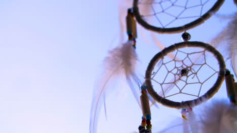 Close-Up-Shot-of-a-Dreamcatcher-Spinning-In-the-Wind