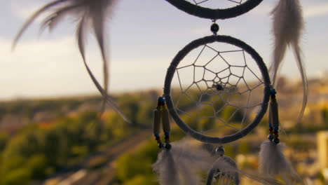 Close-Up-Shot-of-a-Dreamcatcher-Swaying-In-the-Wind