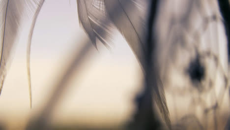 Extreme-Close-Up-Shot-of-a-Dreamcatcher-Swaying-In-the-Wind
