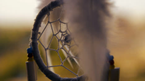Extreme-Close-Up-Shot-of-Dreamcatcher-Swaying-In-the-Wind
