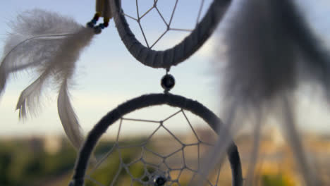 Extreme-Close-Up-Shot-of-Dreamcatcher-Rotating-In-the-Wind
