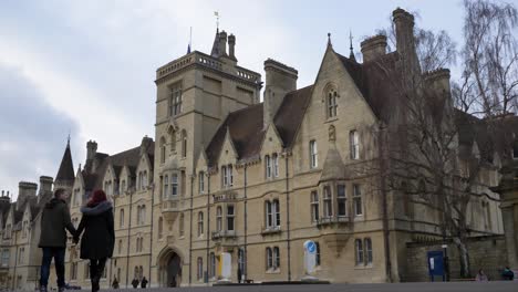 Low-Angle-Wide-Shot-of-Balliol-College-As-Pedestrians-Walk-Past