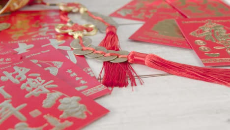Sliding-Close-Up-Shot-of-Pile-of-Chinese-New-Year-Red-Envelopes