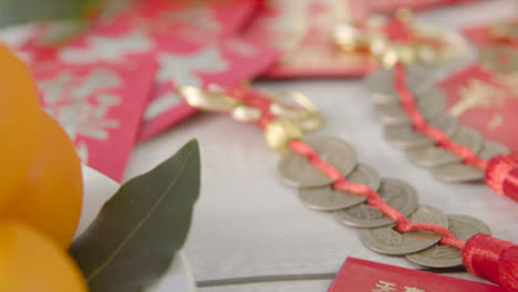 Sliding-Close-Up-Shot-of-Pile-of-Chinese-New-Year-Red-Pockets