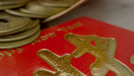 Sliding-Macro-Shot-of-Chinese-New-Year-Red-Envelopes-and-Coins