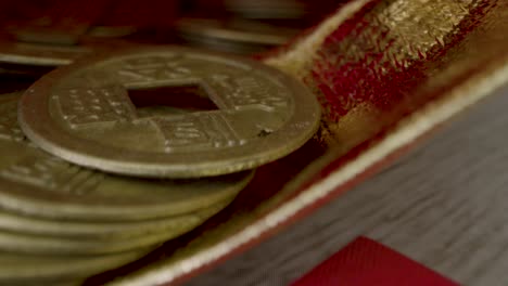Sliding-Macro-Shot-of-Chinese-New-Year-Red-Envelopes-and-Coins