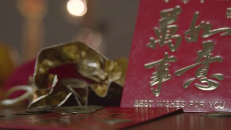 Sliding-Shot-of-Chinese-New-Year-Red-Envelopes-and-Coins